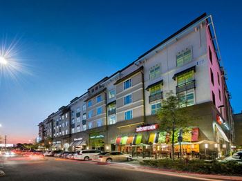 A large building with cars parked in front of it